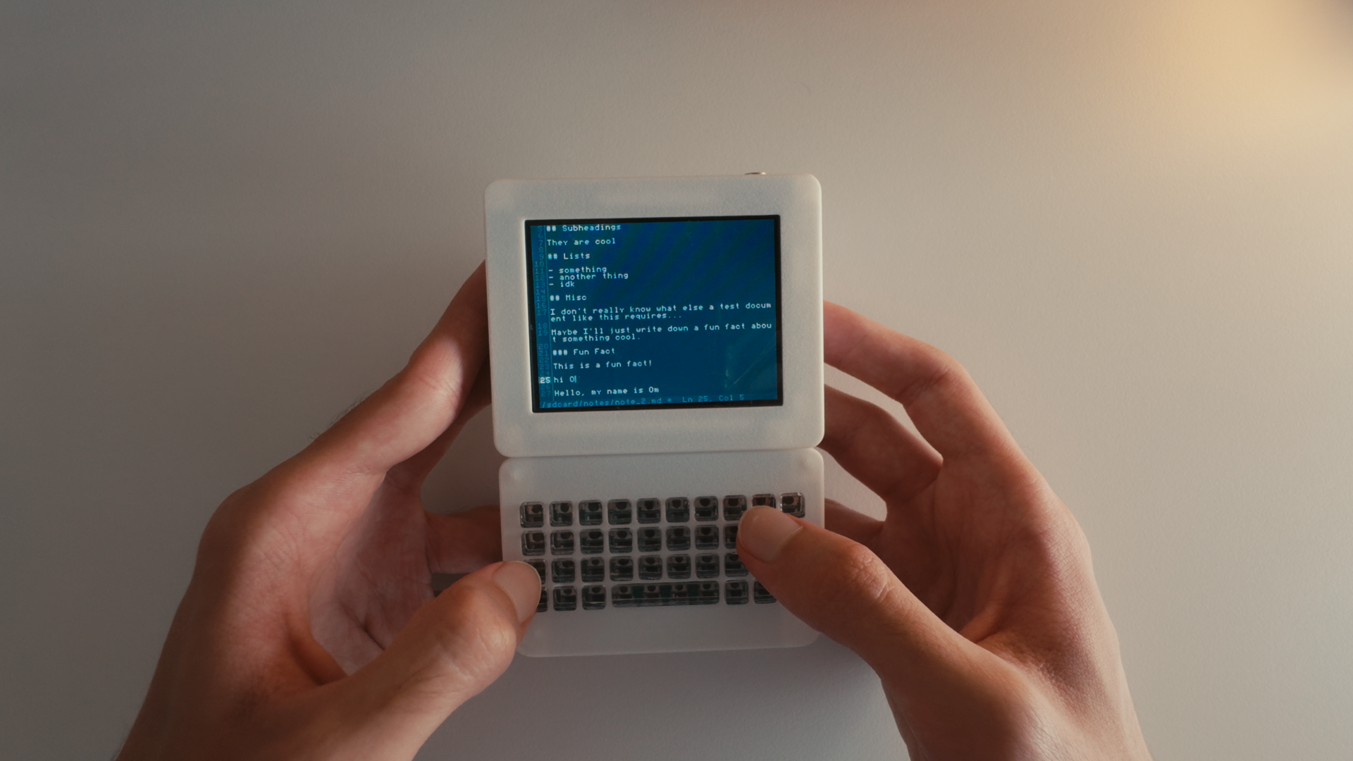 Pocketbyte connected to a laptop running code